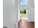 Bright foyer showcasing wood floors and an open view to the front yard at 4506 White Rd, Douglasville, GA 30135