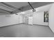 Spacious garage featuring ample storage space, a refrigerator, and a water heater at 4506 White Rd, Douglasville, GA 30135