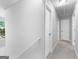 Bright hallway with neutral paint, plush carpet, and access to multiple rooms at 4506 White Rd, Douglasville, GA 30135