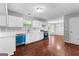 Open kitchen features white cabinets, laminate countertops and stainless steel appliances at 4506 White Rd, Douglasville, GA 30135