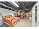 Basement features bed, kitchen area, and tile flooring, offering versatile living space at 6645 N Glen Dr, Cumming, GA 30028