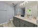 Stylish bathroom features double sinks, quartz countertops, and modern lighting fixtures at 6645 N Glen Dr, Cumming, GA 30028