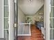 Inviting entryway featuring hardwood floors, and a view into the living room at 6645 N Glen Dr, Cumming, GA 30028