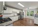 Bright kitchen featuring stainless steel appliances, and ample counter space at 6645 N Glen Dr, Cumming, GA 30028