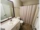 Cozy bathroom with a vanity, toilet, and a shower with framed mirror and a shower curtain at 110 Shelby Oaks Trl, Covington, GA 30016
