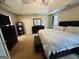 Primary bedroom with a tray ceiling, neutral decor, and plenty of space at 110 Shelby Oaks Trl, Covington, GA 30016