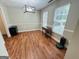 Bright dining room with wood floors and large windows for ample natural light at 110 Shelby Oaks Trl, Covington, GA 30016