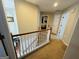 Second floor hallway with view of stairs at 110 Shelby Oaks Trl, Covington, GA 30016