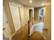 Second floor hallway with carpet and wood banister at 110 Shelby Oaks Trl, Covington, GA 30016