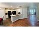 Spacious kitchen that opens to living space, featuring white cabinets, black appliances, and lots of counter space at 110 Shelby Oaks Trl, Covington, GA 30016