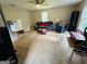 Expansive living room featuring couches, chairs, tables, and good natural light at 110 Shelby Oaks Trl, Covington, GA 30016