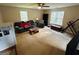 Large living room filled with couches, chairs, and tables with soft carpet and lots of natural light at 110 Shelby Oaks Trl, Covington, GA 30016