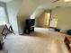 Lofted living room with neutral walls and carpeted floors, with a tv and window for natural light at 110 Shelby Oaks Trl, Covington, GA 30016