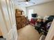 Storage room full of packed cardboard and plastic boxes with neutral walls and carpeted floor at 110 Shelby Oaks Trl, Covington, GA 30016