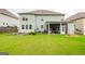 Spacious backyard with a screened-in porch, lush lawn, and well-maintained landscaping at 4752 Albany Way, South Fulton, GA 30331
