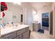Well-lit bathroom with gray vanity, white countertops, and neutral flooring at 4752 Albany Way, South Fulton, GA 30331