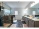 Modern bathroom featuring a glass shower, soaking tub, and a double sink vanity at 4752 Albany Way, South Fulton, GA 30331