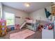 A bedroom with bunkbeds, toys, a window, and a TV at 4752 Albany Way, South Fulton, GA 30331