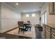 Cozy dining room features a dark wood table with bench seating and stylish gray upholstered chairs on an elegant rug at 4752 Albany Way, South Fulton, GA 30331