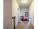 Upstairs hallway with movie decor and carpet floors, featuring a red bench and neon sign at 4752 Albany Way, South Fulton, GA 30331