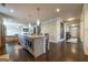 Open concept kitchen with stainless steel appliances, granite countertops, and a spacious island with seating at 4752 Albany Way, South Fulton, GA 30331