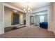Bright living room with fresh paint, plush blue chairs, ceiling fan, and plenty of natural light at 4752 Albany Way, South Fulton, GA 30331