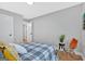 Bright bedroom with plank floors, neutral decor, a window view, and comfortable queen bed at 786 Neal Nw St, Atlanta, GA 30318