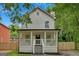 Charming two-story home featuring a welcoming front porch and classic architectural details at 786 Neal Nw St, Atlanta, GA 30318