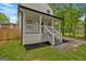Side view of a quaint two-story home with a lovely front porch and manicured lawn at 786 Neal Nw St, Atlanta, GA 30318
