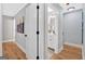 Hallway leading to a bathroom and an adjacent bedroom with hardwood floors at 786 Neal Nw St, Atlanta, GA 30318