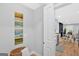 Hallway featuring art and a doorway that leads to an open kitchen and dining area at 786 Neal Nw St, Atlanta, GA 30318