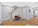 Hallway with hardwood floors, a staircase, and a stylish bench at 786 Neal Nw St, Atlanta, GA 30318