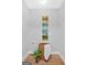 Hallway featuring art, wood floors, a plant and stylish decor at 786 Neal Nw St, Atlanta, GA 30318