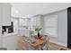 Bright open kitchen featuring white cabinets, stainless steel appliances, and an adjacent dining area at 786 Neal Nw St, Atlanta, GA 30318