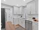 Bright kitchen with white cabinets, stainless steel appliances, and modern fixtures at 786 Neal Nw St, Atlanta, GA 30318
