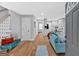 Bright, open-concept living area with hardwood floors, modern furnishings and a staircase at 786 Neal Nw St, Atlanta, GA 30318