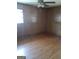 Empty bedroom with hardwood floors and a ceiling fan at 856 New Hope Rd, Fayetteville, GA 30214