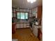 Functional kitchen with white cabinets and a window bringing in natural light at 856 New Hope Rd, Fayetteville, GA 30214