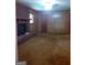 Living room featuring a brick fireplace and neutral carpeting at 856 New Hope Rd, Fayetteville, GA 30214