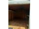 Interior view of a shed with wooden walls, a wooden floor, and storage shelves at 856 New Hope Rd, Fayetteville, GA 30214