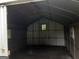 Interior view of a shed with metal walls, a metal roof, and small windows at 856 New Hope Rd, Fayetteville, GA 30214