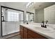 Modern bathroom featuring double sink vanity and a glass enclosed shower at 9067 Bob Jackson Dr, Jonesboro, GA 30238