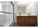 Well lit bathroom featuring a double sink vanity and a walk-in shower at 9067 Bob Jackson Dr, Jonesboro, GA 30238