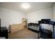 Bedroom featuring a crib, treadmill, and dresser, suitable as a Bedroom at 9067 Bob Jackson Dr, Jonesboro, GA 30238