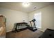 Bedroom with a black crib, treadmill, and a dresser for a Bedroom at 9067 Bob Jackson Dr, Jonesboro, GA 30238