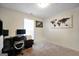 Bedroom with a desk, chair, computer equipment, and a world map on the wall at 9067 Bob Jackson Dr, Jonesboro, GA 30238