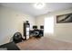 Bedroom featuring a desk, computers, bookcase, and a large window for natural light at 9067 Bob Jackson Dr, Jonesboro, GA 30238