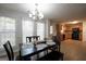 Dining area filled with natural light and stylish chandelier, located near kitchen at 9067 Bob Jackson Dr, Jonesboro, GA 30238
