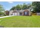 Attractive single-story brick home with a two-car garage and manicured lawn at 9067 Bob Jackson Dr, Jonesboro, GA 30238