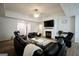 Large living room featuring a fireplace, lots of seating, and a ceiling fan at 9067 Bob Jackson Dr, Jonesboro, GA 30238